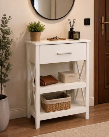 Mueble blanco con cajón y estantes, decorado con plantas y accesorios en un entorno acogedor.