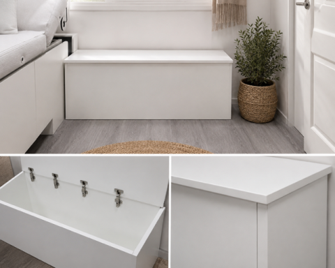 Banco de almacenamiento blanco con tapa y decorativa planta en maceta al lado.